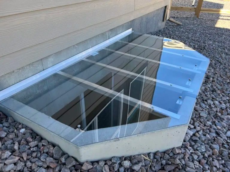 Clear polycarbonate window well cover with metal supports