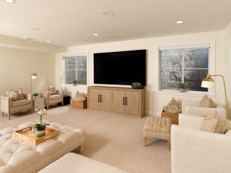 Finished basement family room lit by egress windows