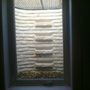 Stone Window Well With Ladder